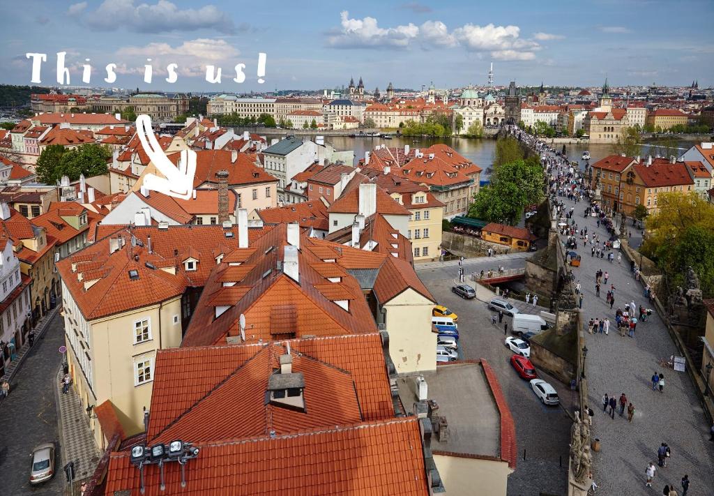 an overhead view of a city with a river and buildings at Queen Bee apartments in Prague