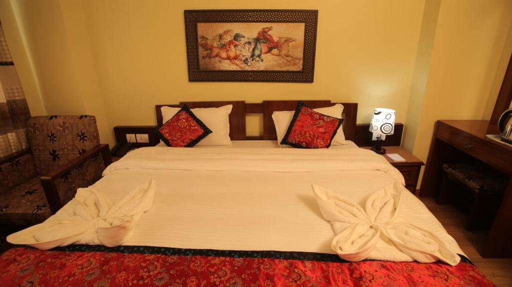 Postel nebo postele na pokoji v ubytování Hotel Osho Home