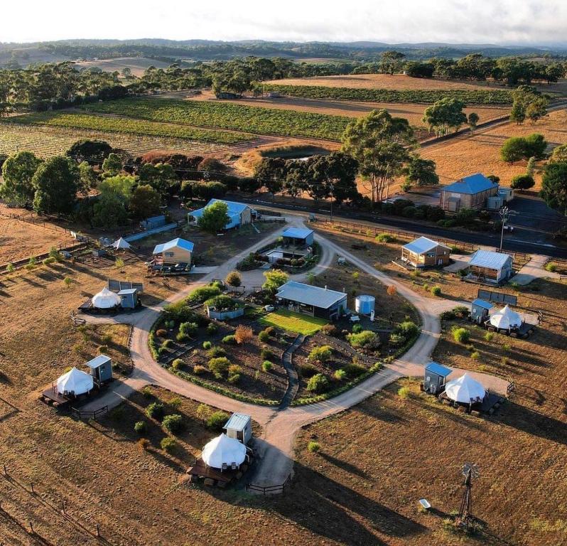 una vista aerea di una fattoria con tende e una strada di Bukirk Glamping & Fancy Coops a Clare