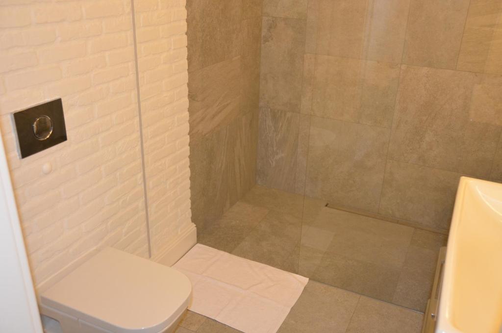 Kúpeľňa v ubytovaní Apartamenty Adalbert