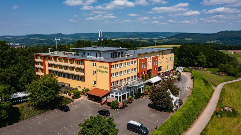 an overhead view of a building with a parking lot at Landhotel Klingerhof in Hösbach