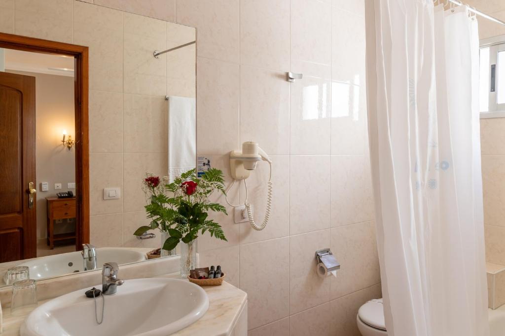Koupelna v ubytování Hotel Marte