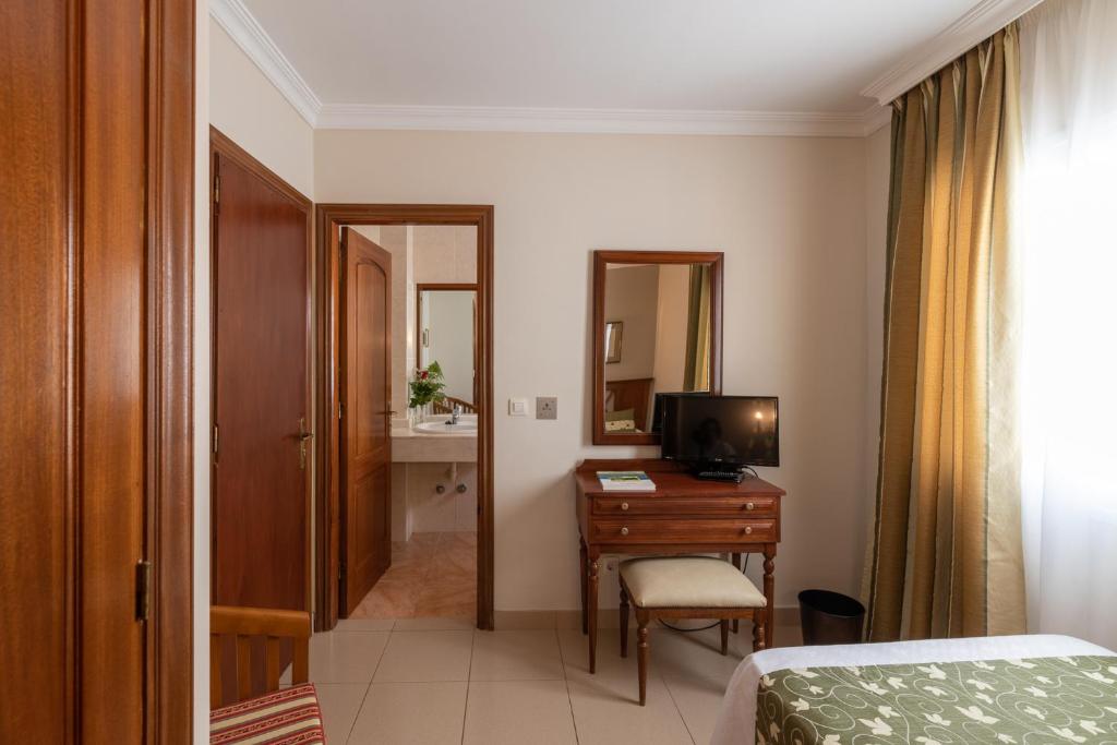 TV a/nebo společenská místnost v ubytování Hotel Marte