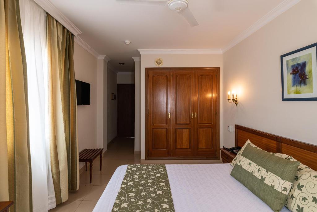 Postel nebo postele na pokoji v ubytování Hotel Marte