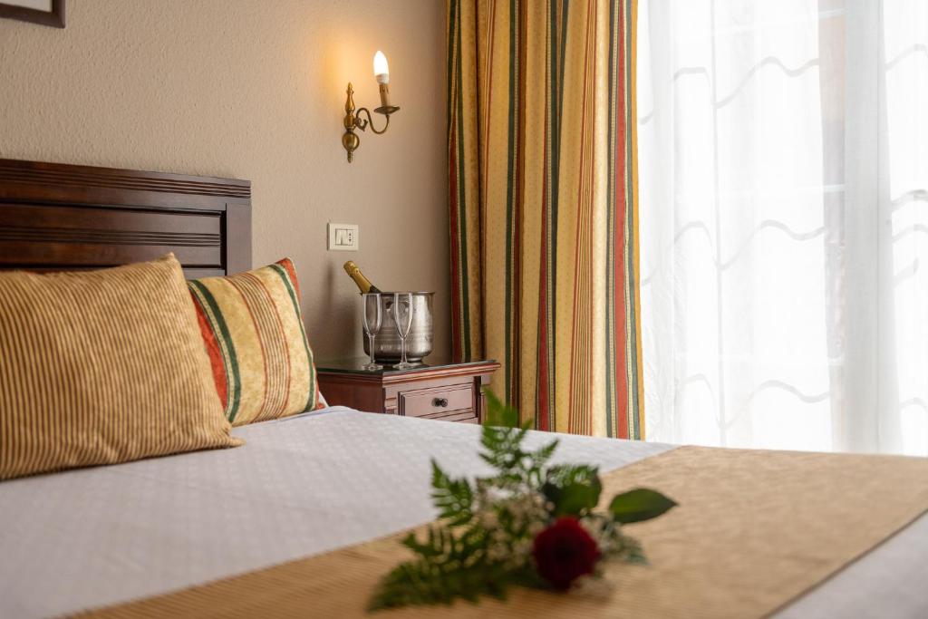 Postel nebo postele na pokoji v ubytování Hotel Marte