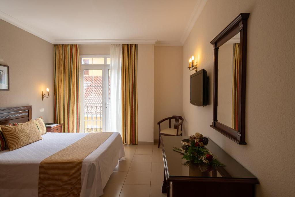 Postel nebo postele na pokoji v ubytování Hotel Marte