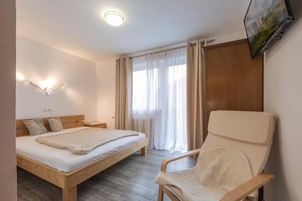 Postel nebo postele na pokoji v ubytování Pension Steinadler