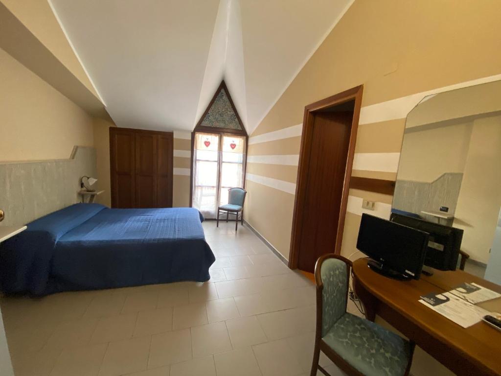 Postel nebo postele na pokoji v ubytování Hotel Ristorante Ligure