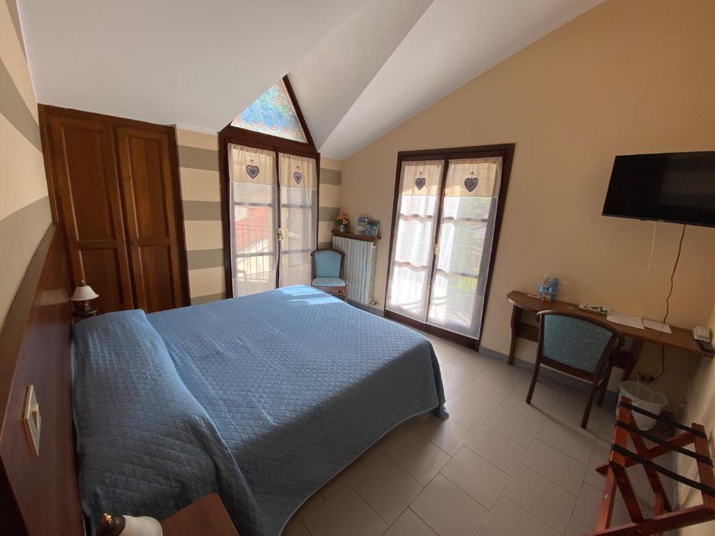 Postel nebo postele na pokoji v ubytování Hotel Ristorante Ligure