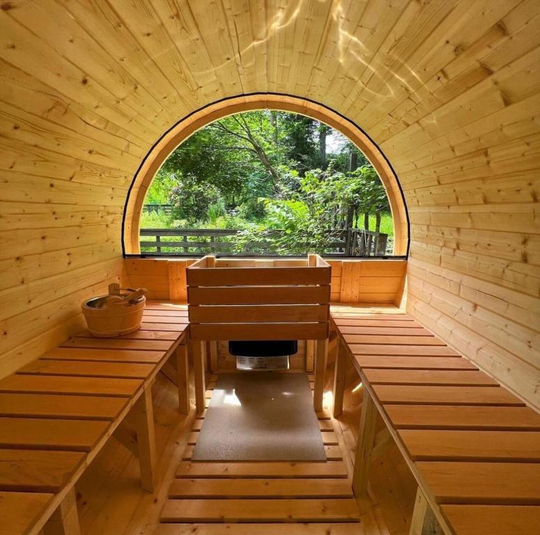 an inside of a sauna with a window at The No.10 山中湖／サウナとBBQ、焚き火が楽しめる自然に囲まれた別荘【ペット可】 in Yamanakako