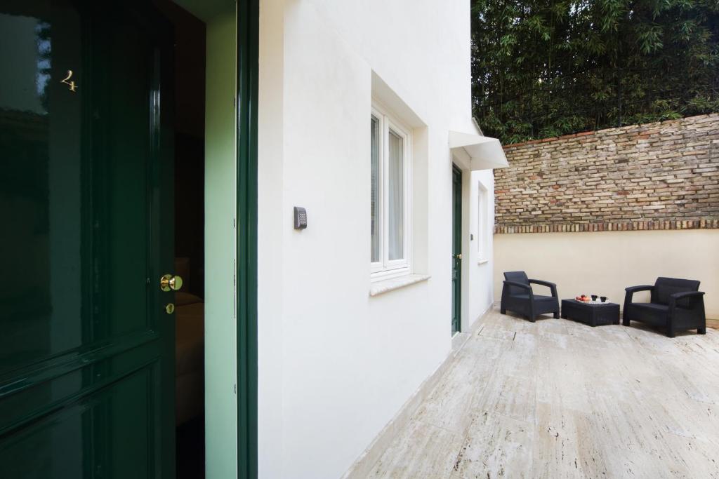 A patio or other outdoor area at The One Prati Rooms