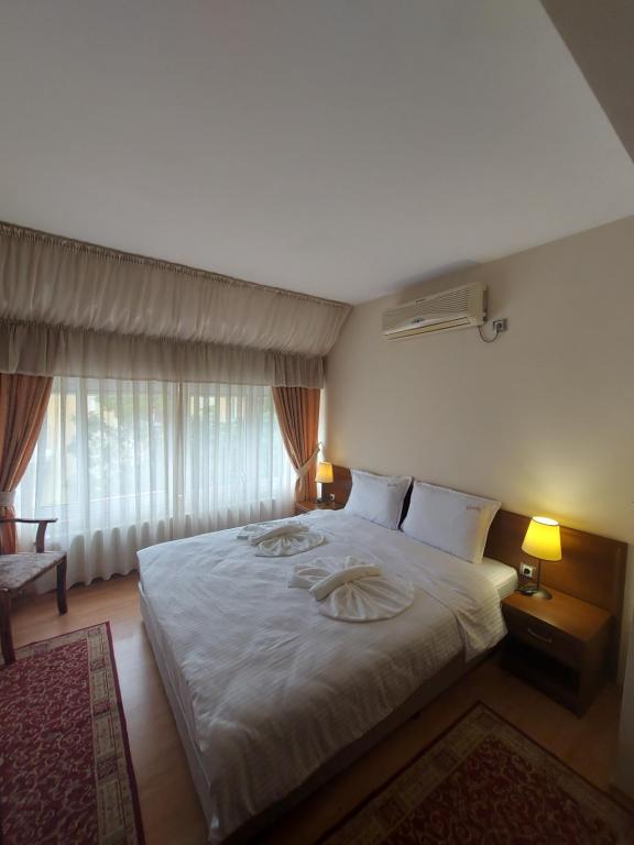 Postel nebo postele na pokoji v ubytování Elegant Complex