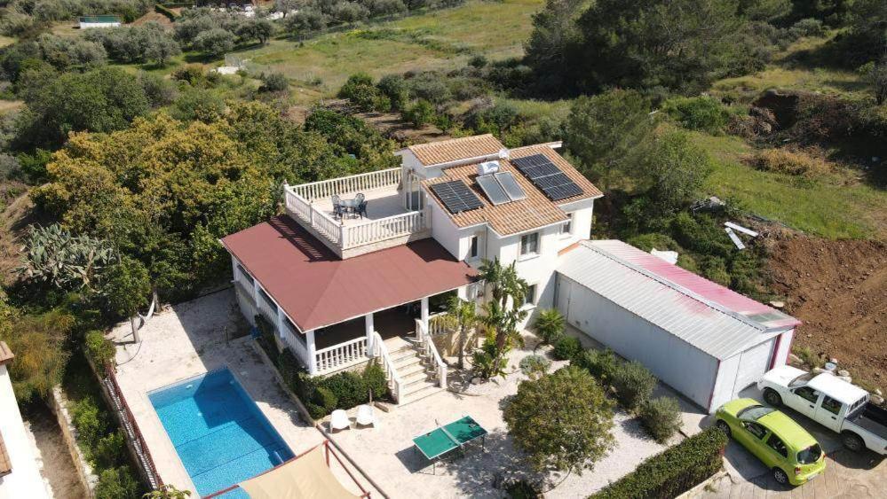 an aerial view of a house with solar panels on it at Pomos Harbourbiew Villa in Pomos