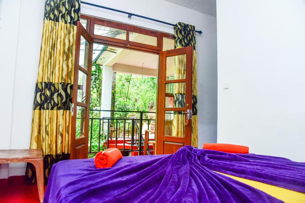 Postel nebo postele na pokoji v ubytování MUM Jungle Inn