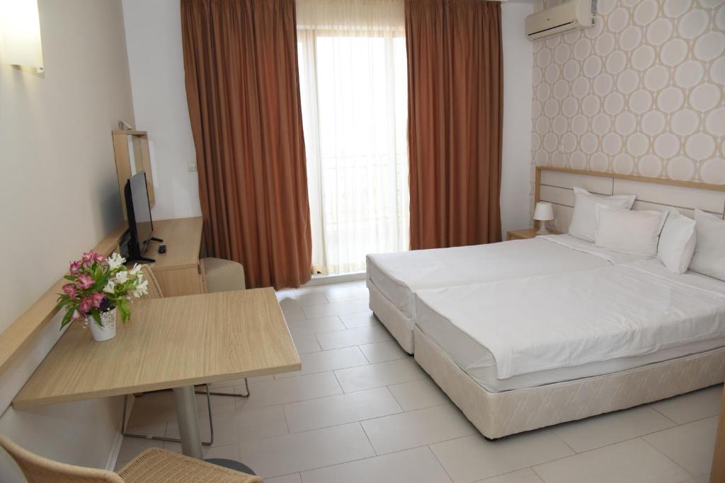 Postel nebo postele na pokoji v ubytování Hotel Paradise Garden