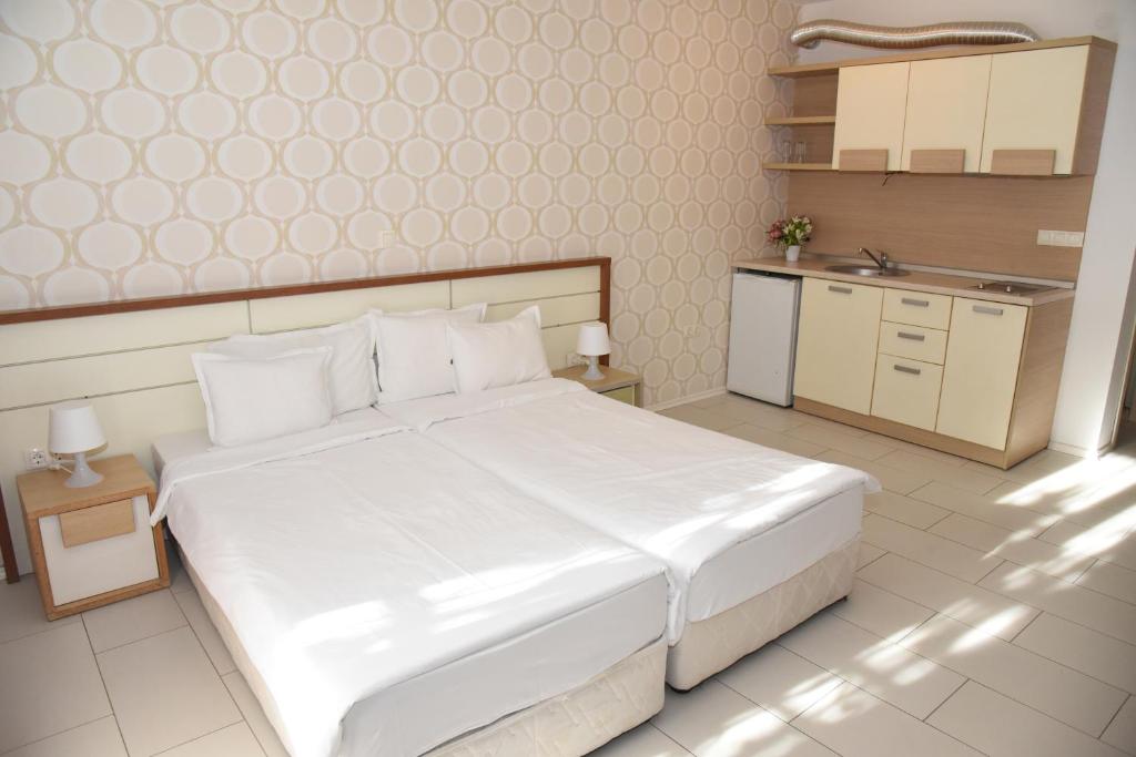 Postel nebo postele na pokoji v ubytování Hotel Paradise Garden