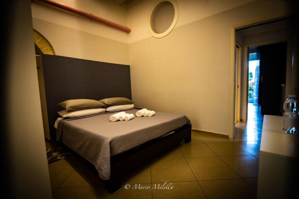 Postel nebo postele na pokoji v ubytování KiMia Home, Centro