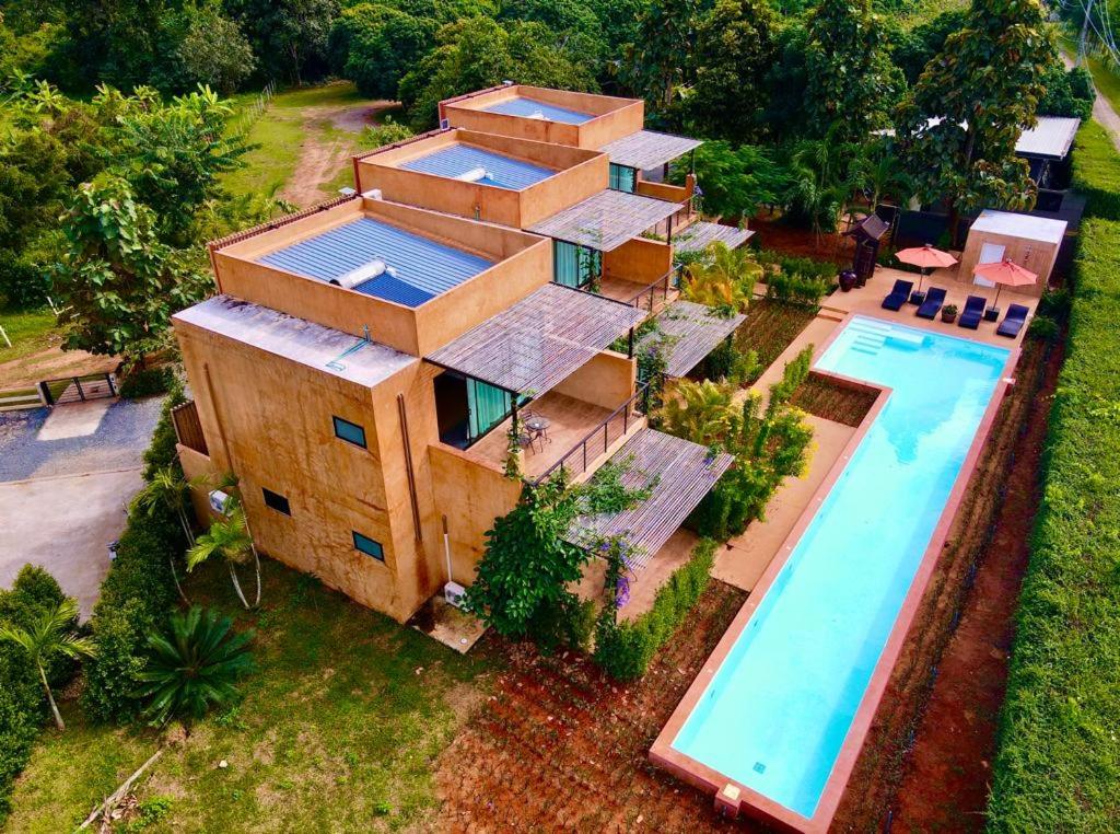 an aerial view of a house with a swimming pool at Bougain Villas in Chiang Dao