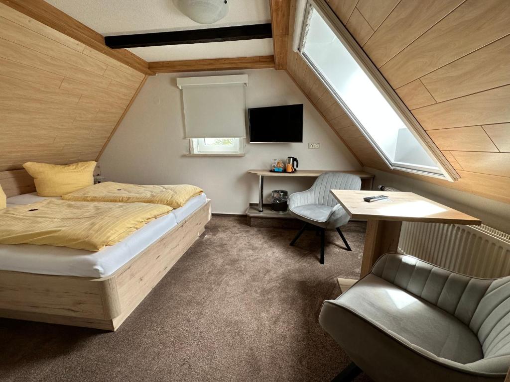 Postel nebo postele na pokoji v ubytování Hotel Peters Schwalbennest