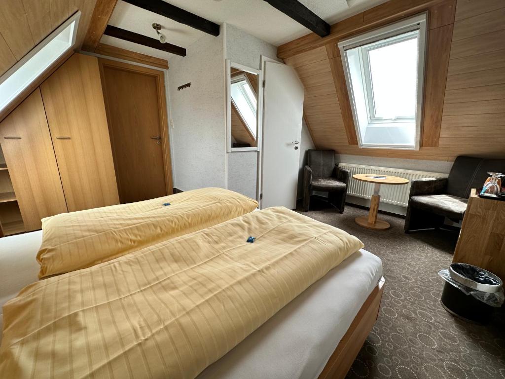 Postel nebo postele na pokoji v ubytování Hotel Peters Schwalbennest