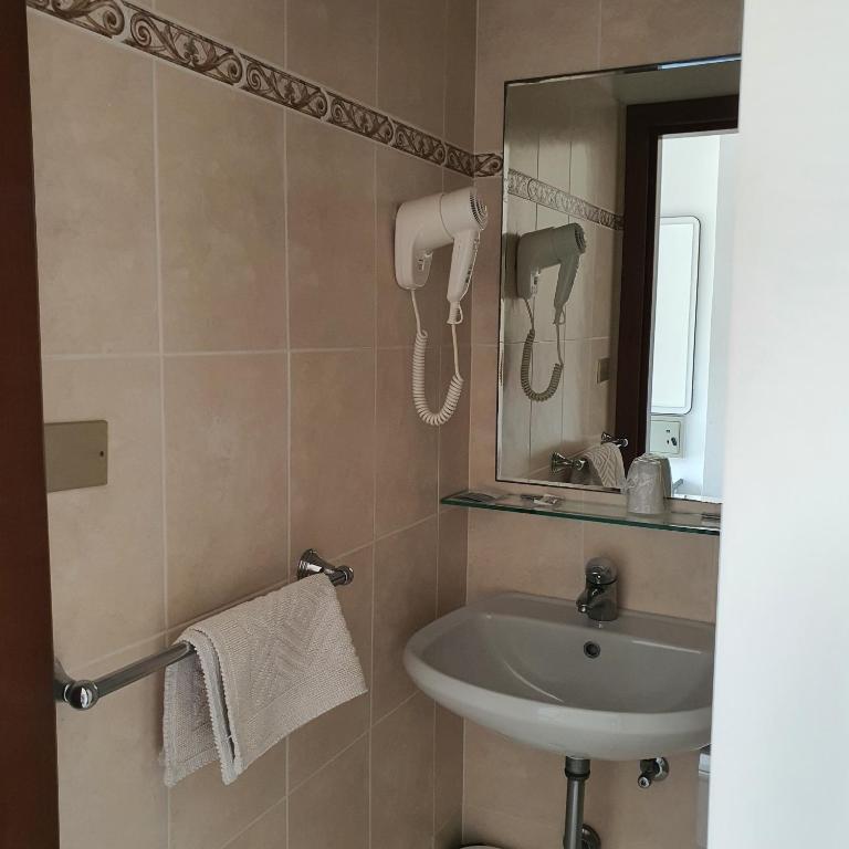 Koupelna v ubytování Hotel Tre Assi