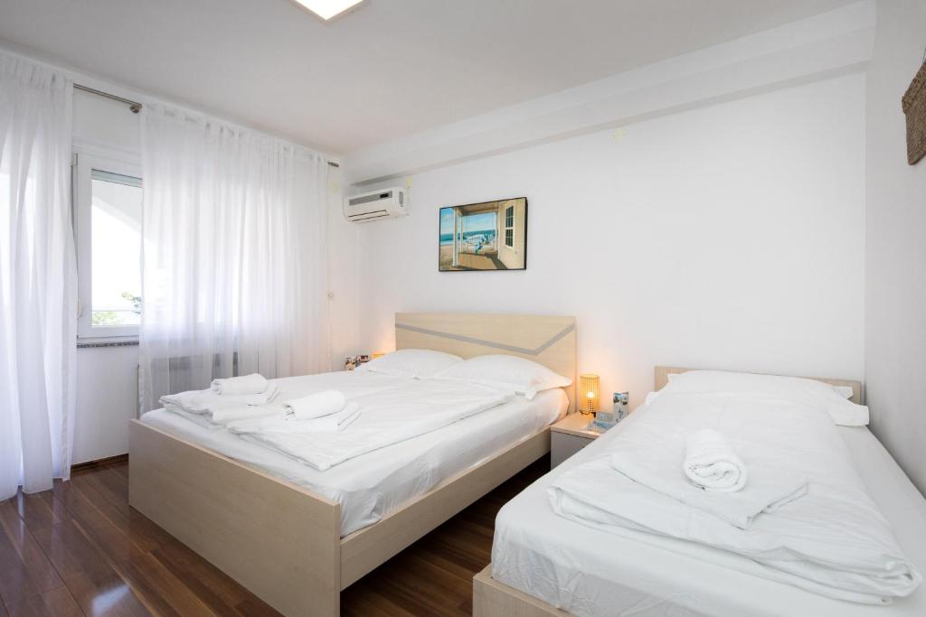Postel nebo postele na pokoji v ubytování Apartments Soul