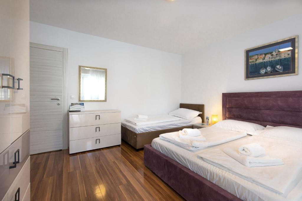 Postel nebo postele na pokoji v ubytování Apartments Soul