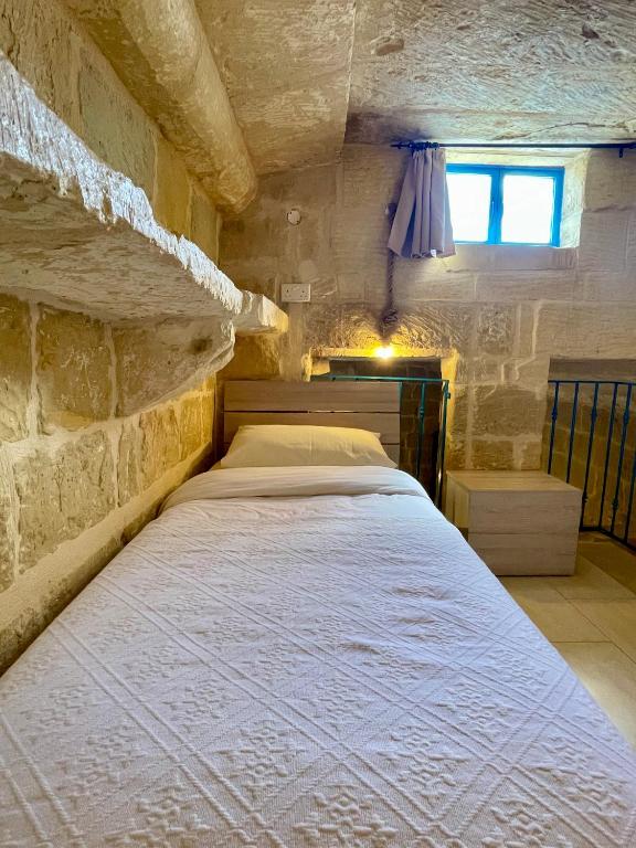 Postel nebo postele na pokoji v ubytování Ta Pinu Guesthouse