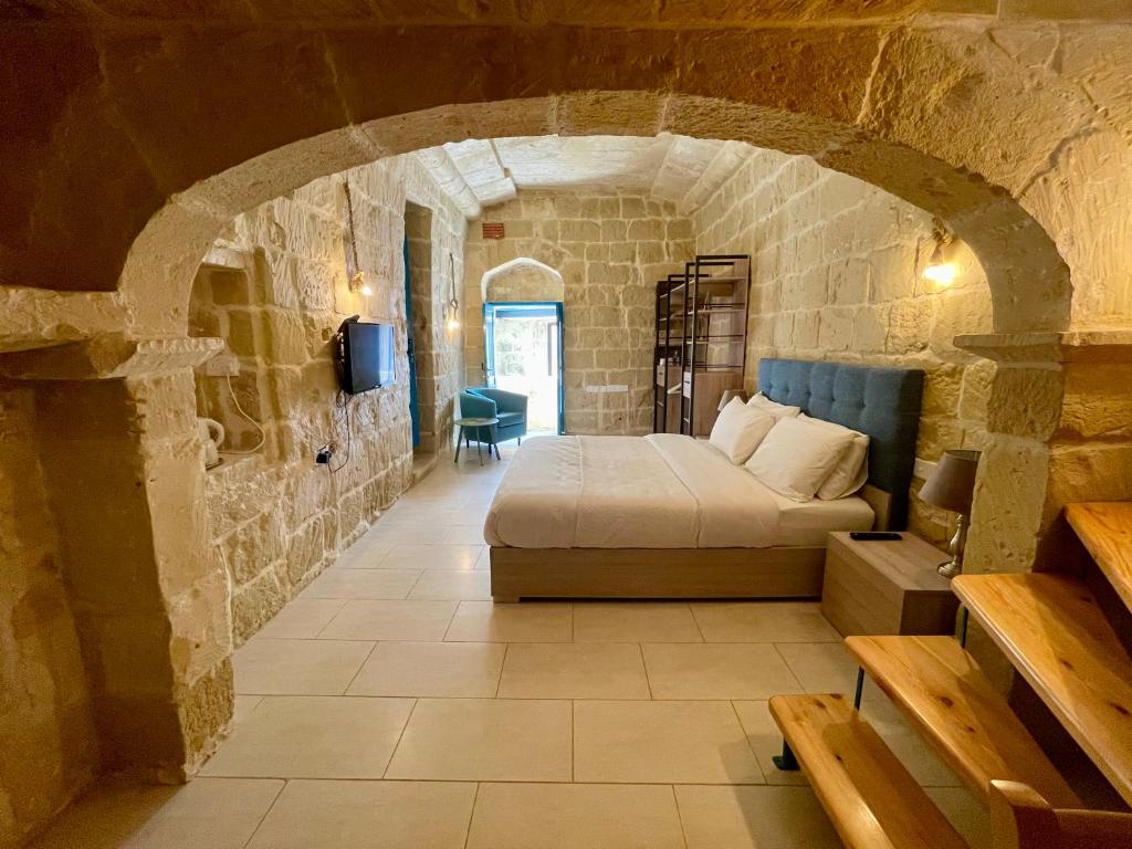 Postel nebo postele na pokoji v ubytování Ta Pinu Guesthouse