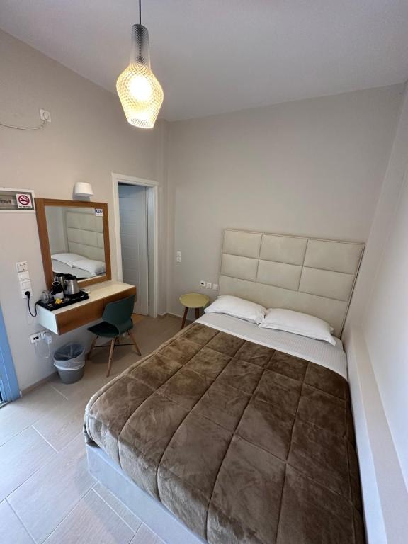 Postel nebo postele na pokoji v ubytování Villa Roussa City Center