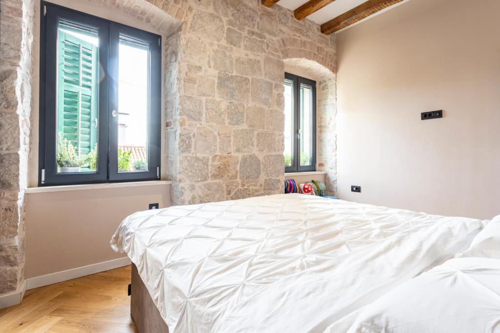 Postel nebo postele na pokoji v ubytování Circle Rooms