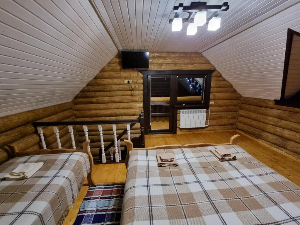 Postel nebo postele na pokoji v ubytování Шепіт Карпат