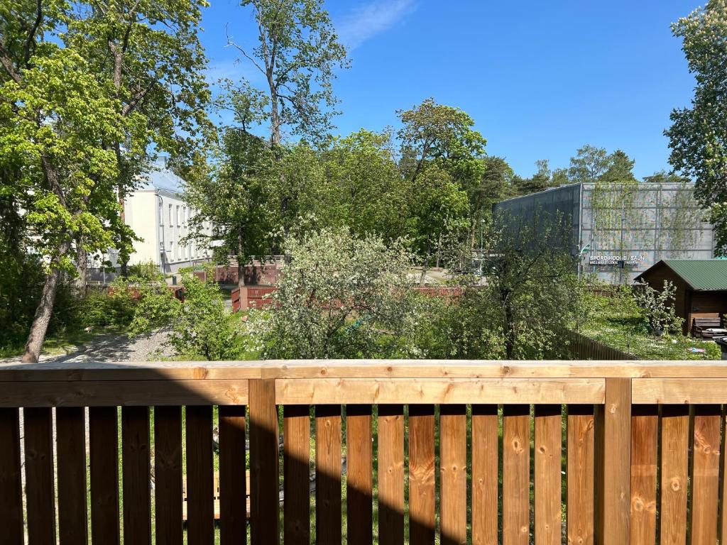 a wooden fence with a garden in the background at Nõmme Apartments in Tallinn