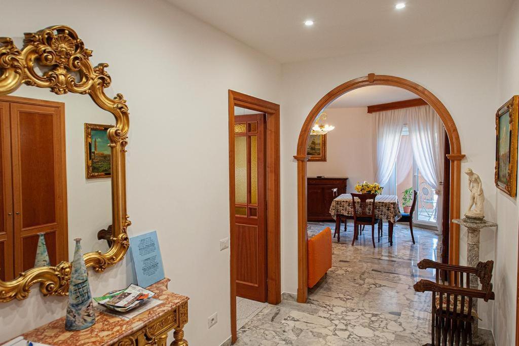 a room with a mirror and a dining room at Naveen's House in Rome