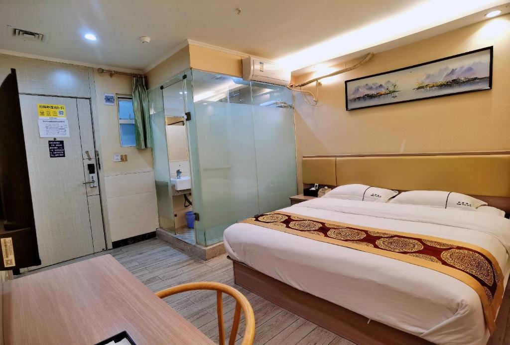 Postel nebo postele na pokoji v ubytování Songyuan Hotel 松缘酒店