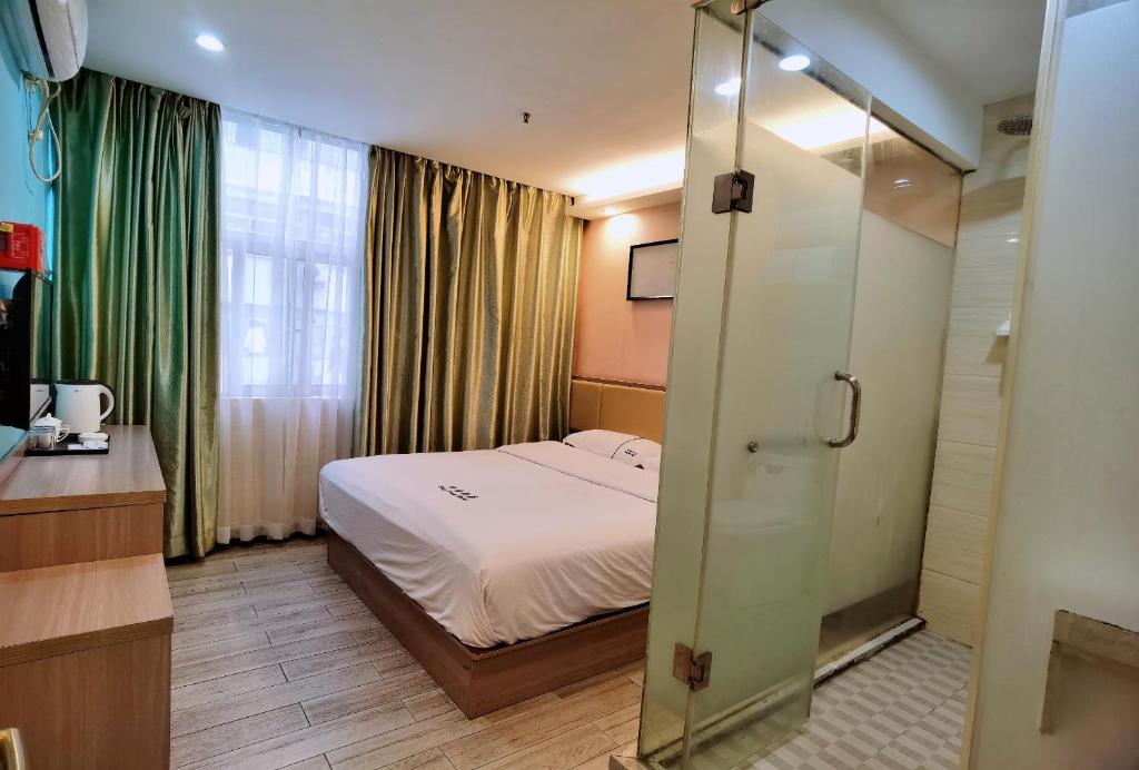 Postel nebo postele na pokoji v ubytování Songyuan Hotel 松缘酒店