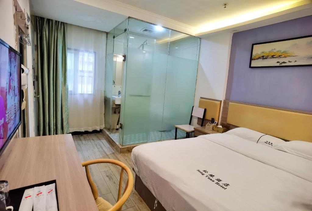 TV a/nebo společenská místnost v ubytování Songyuan Hotel 松缘酒店