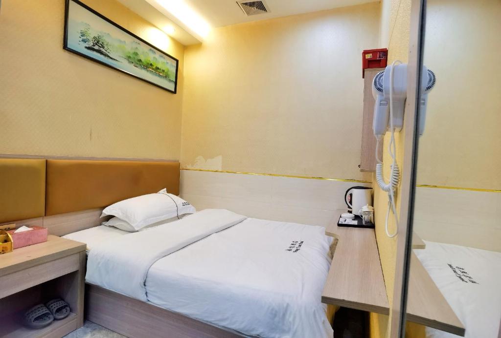 Postel nebo postele na pokoji v ubytování Songyuan Hotel 松缘酒店