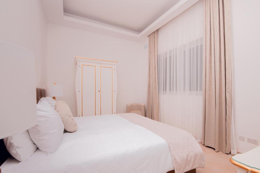 Cama o camas de una habitación en Giorgio Boutique Hotel