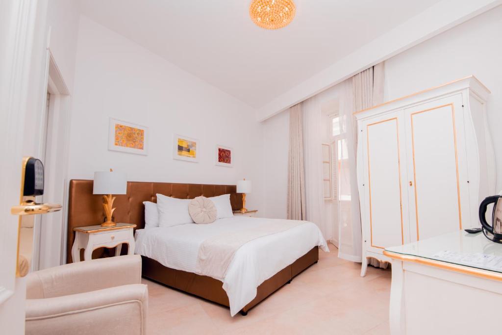 Cama o camas de una habitación en Giorgio Boutique Hotel
