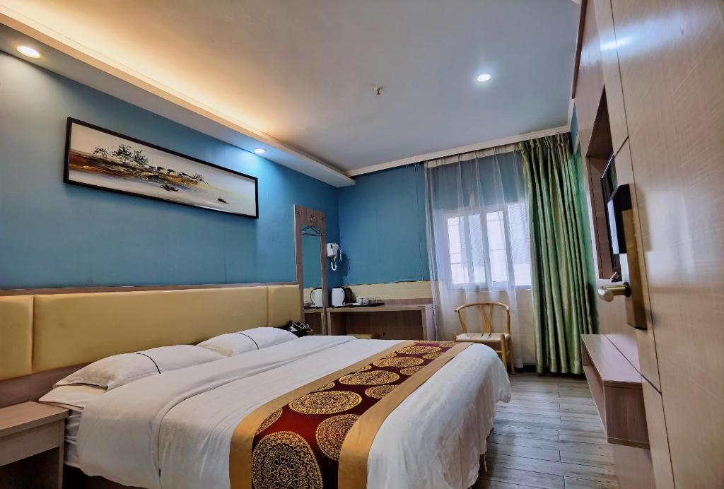 Postel nebo postele na pokoji v ubytování Songyuan Hotel 松缘酒店