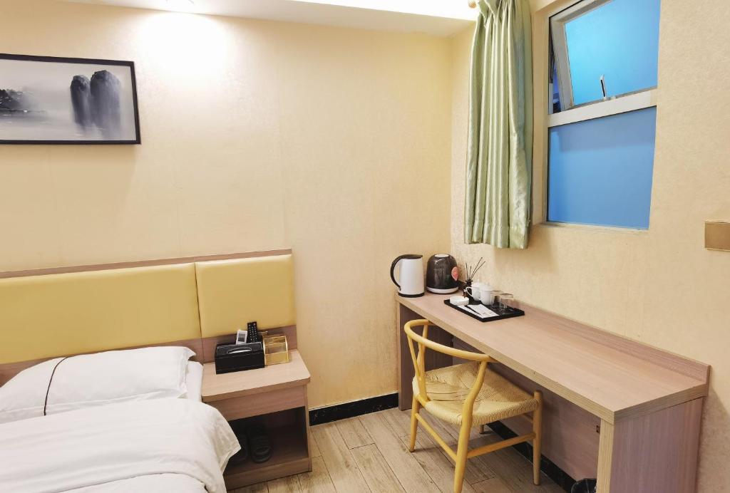 Postel nebo postele na pokoji v ubytování Songyuan Hotel 松缘酒店