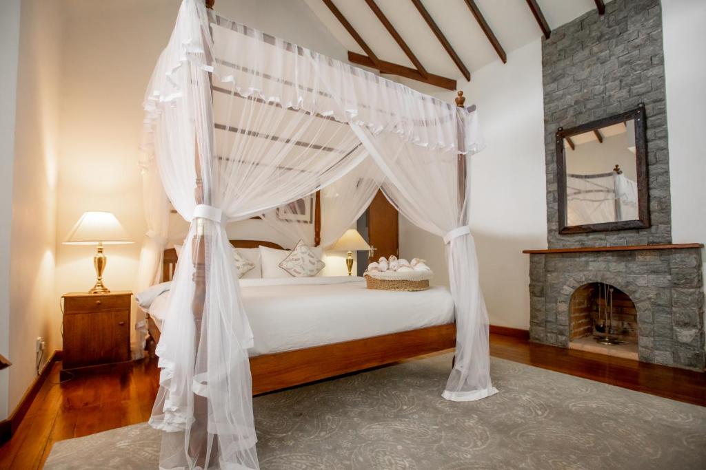 Postel nebo postele na pokoji v ubytování Manuel Manor