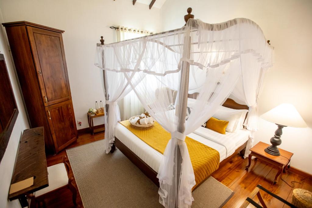 Postel nebo postele na pokoji v ubytování Manuel Manor