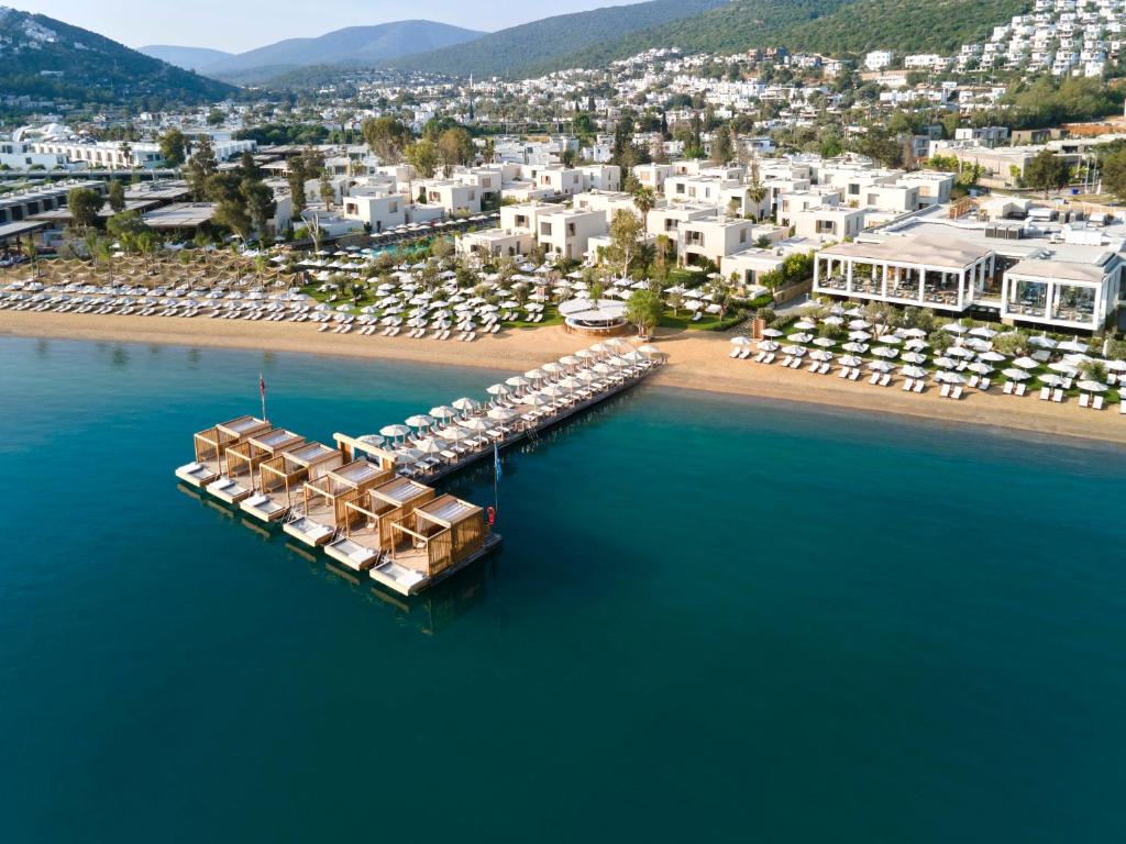 an aerial view of a beach with a resort at Voyage Torba Hotel in Torba