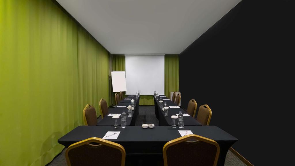 a conference room with a long table and chairs at Park Inn by Radisson Istanbul Asia Kavacik in Istanbul