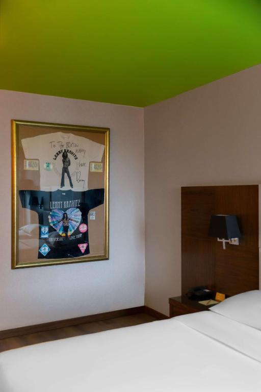 a bedroom with a poster on the wall and a bed at Park Inn by Radisson Istanbul Asia Kavacik in Istanbul