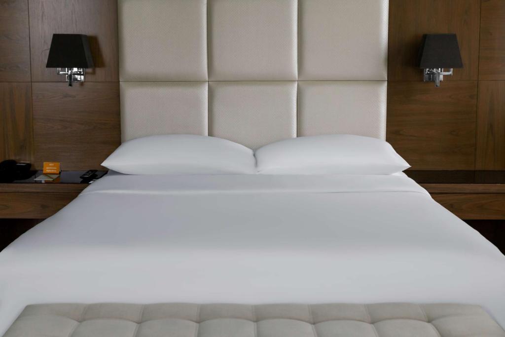 a large white bed with two pillows on it at Park Inn by Radisson Istanbul Asia Kavacik in Istanbul