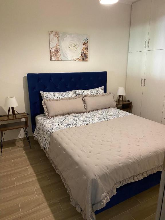Postel nebo postele na pokoji v ubytování Kaldis Apartment