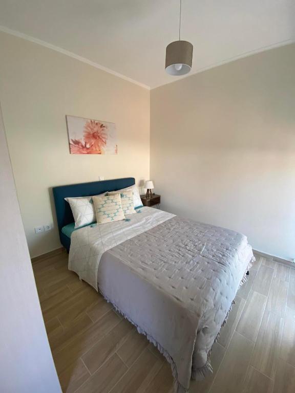 Postel nebo postele na pokoji v ubytování Kaldis Apartment